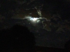  moon emerging from clouds