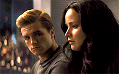  The way Peeta looks at Katniss when she's not looking