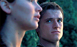 The way Peeta looks at Katniss when she's not looking