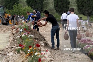  People carry the coffins of the miners to the cemetery after a mining disaster in Soma