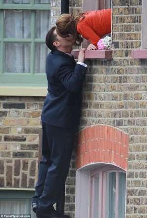 Tom Hardy climbs drainpipe to steal kiss and 'propose' to Emily Browning as they film Krays biopic