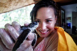  Demi became a Godparent of a schildpad at the Meridien Resort in Bora Bora - August 2014