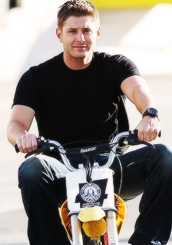  Jensen Riding a Small Motorcycle