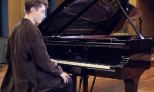greyson playing Piano