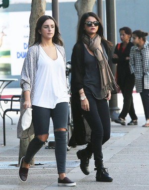 November 2: Selena stops por starbucks with a friend in Los Angeles, CA