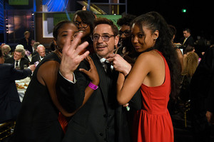  Robert Downey Jr. looking happy and cute with an assortment of people at the 2014 Britannia Awards