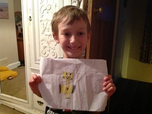 Sam holding a picture for Stampy 