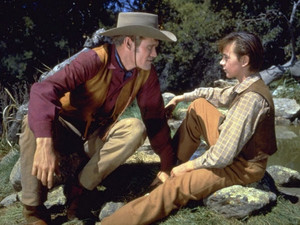 Chuck Connors as Burn Sanderson and Tommy Kirk as Travis Coates in Old Yeller