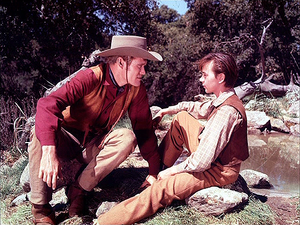 Chuck Connors as Burn Sanderson and Tommy Kirk as Travis Coates in Old Yeller