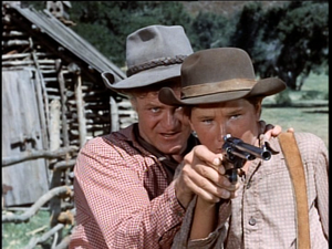  Kevin Corcoran as Arliss Coates and Brian Keith as Uncle Beck Coates in Savage Sam
