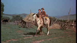  Kevin Corcoran as Arliss Coates and Tommy Kirk as Travis Coates in Old Yeller