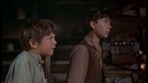  Kevin Corcoran as Arliss Coates and Tommy Kirk as Travis Coates in Old Yeller