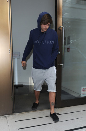Louis leaving Sony Music offices in London