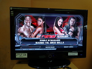  Naomi w/ R-Truth vs. Brie Bella w/ Roman Reigns