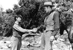  Tommy Kirk as Travis Coates and Chuck Connors as Burn Sanderson in Old Yeller