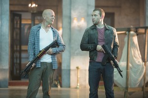 Bruce Willis as John McClane and Jai Courtney as Jack McClane in A Good Day to Die Hard