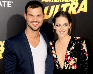  Kristen with Twilight co-star,Taylor Lautner at American Ultra premiere