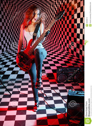girl plays electric guitar sings studio 29268974