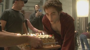  Robert Pattinson blowing out his birthday cake during the filming of New Moon