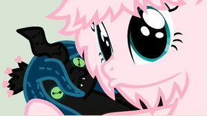  Fluffle puff holding a voodoo doll chrysalis