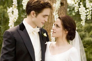 Kristen Stewart as Bella Swan and Robert Pattinson as Edward Cullen in The Twilight Saga Breaking Da