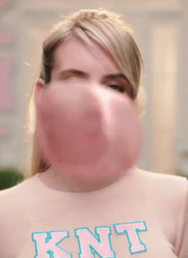  Emma Roberts blows a bubble