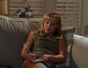 Lizzie writing in a journal