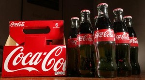  coca cola tops 2q profit forecasts