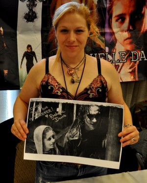  Rochelle Davis holding a picture of herself and Brandon Lee