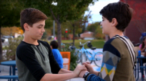  Jonah and Cyrus hold hands (kind of)