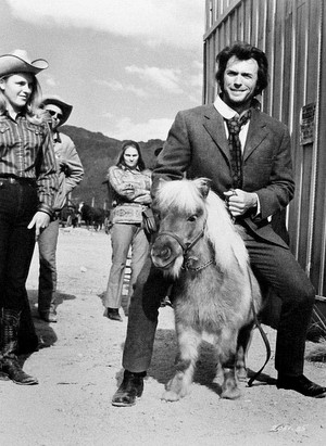 Clint Eastwood 'rides' a miniature pony on the set of Joe Kidd (1972)