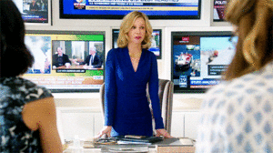 leaning over the desk office Cat Grant style  