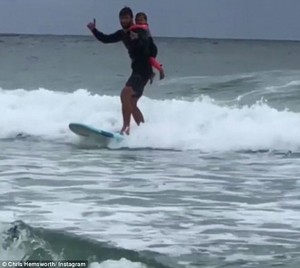 Chris going surfing with daughter India