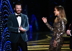  Chris Evans and Jennifer Lopez onstage during the 91st Annual Academy Awards on February 24, 2019