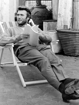 Clint reading a script on set