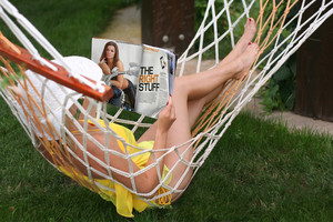 She reading a Allure Magazine