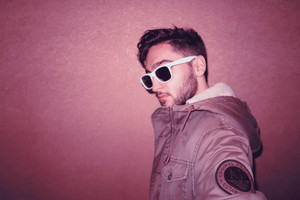 Hotel photo session. Xlson137 in a jacket with a chain