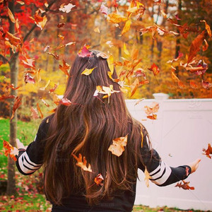  Girl Throwing Fall Leaves