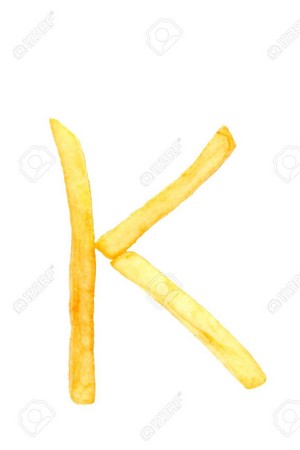 Alphabet letter k from french fries on the white