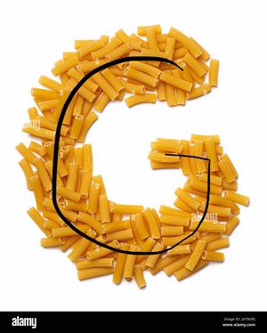  Letter G of the English alphabet from dry pasta, tambi on a white