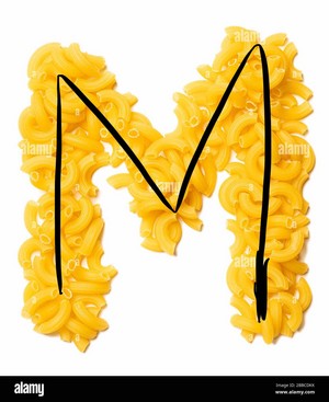 Letter M of the English alphabet from dry pasta on a white