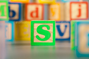 Photograph Of Colorful Wooden Block Letter S