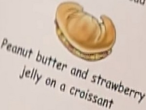 peanut butter and strawberry jelly on a croissant