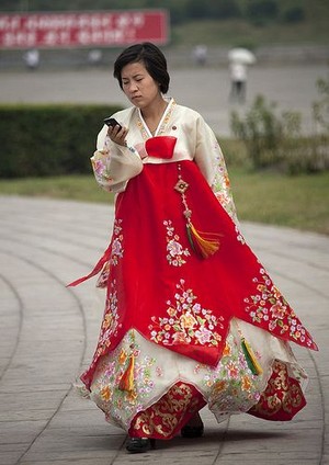  Korean Woman Dressed in Joseon-ot Holding a Smartphone